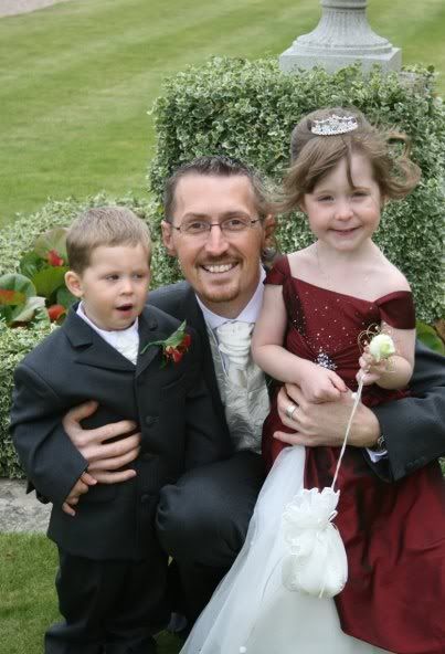 Heres a pic of us at andys sisters wedding last year